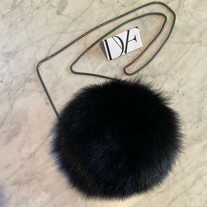 DVF Love Power Tipped Fox Fur Puff bag in black.